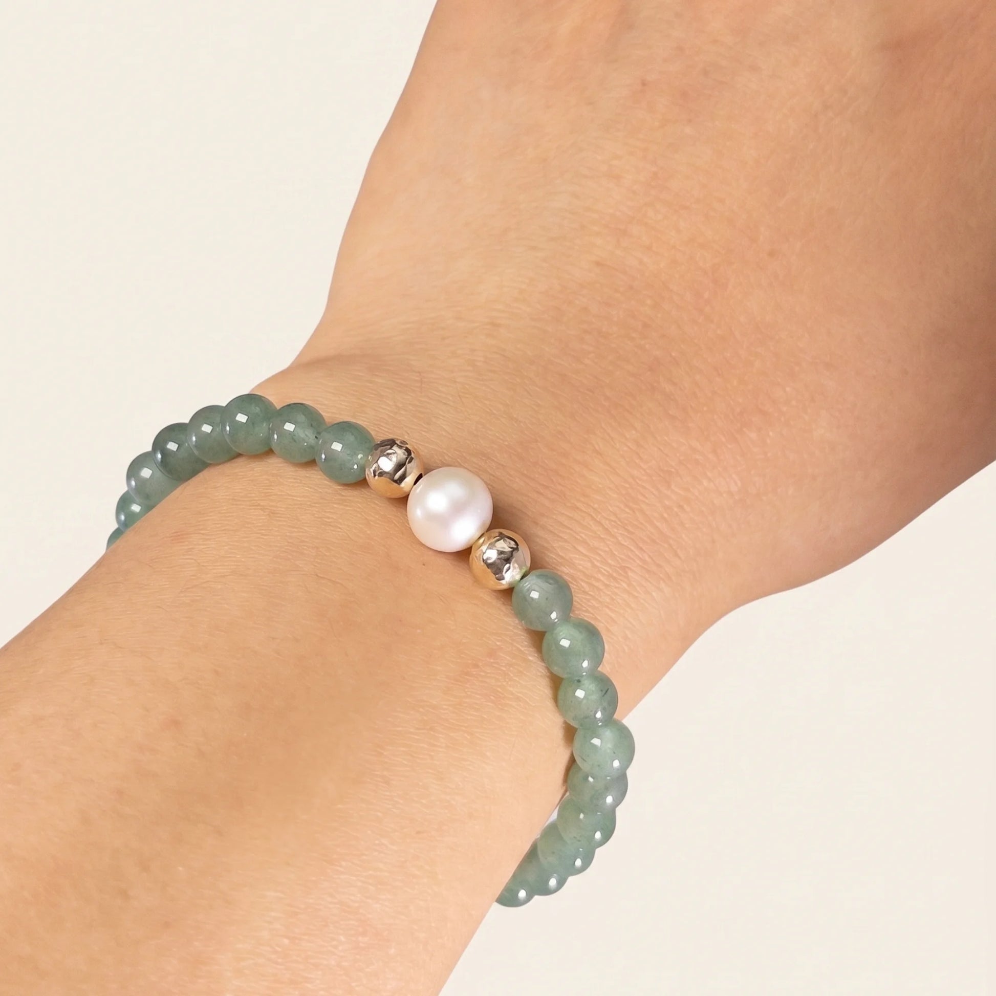 Green aventurine, pearl and initial gold bracelet featuring polished green gemstone beads, lustrous freshwater pearls and a personalised gold-filled stamped initial disc.