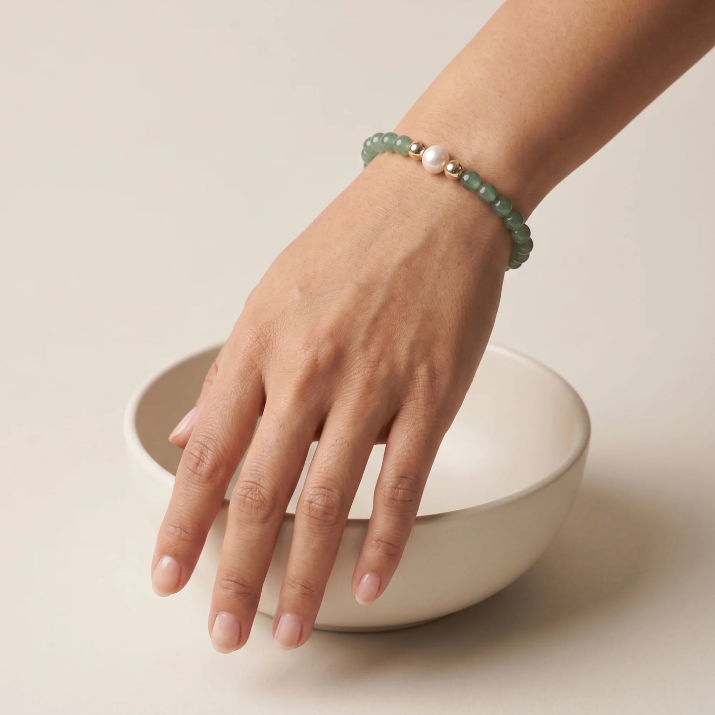 Green aventurine, pearl and initial gold bracelet featuring polished green gemstone beads, lustrous freshwater pearls and a personalised gold-filled stamped initial disc.
