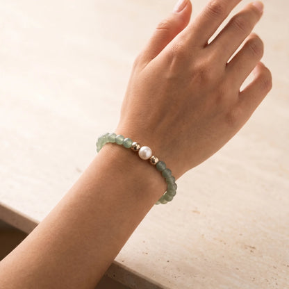 Green aventurine, pearl and initial gold bracelet featuring polished green gemstone beads, lustrous freshwater pearls and a personalised gold-filled stamped initial disc.
