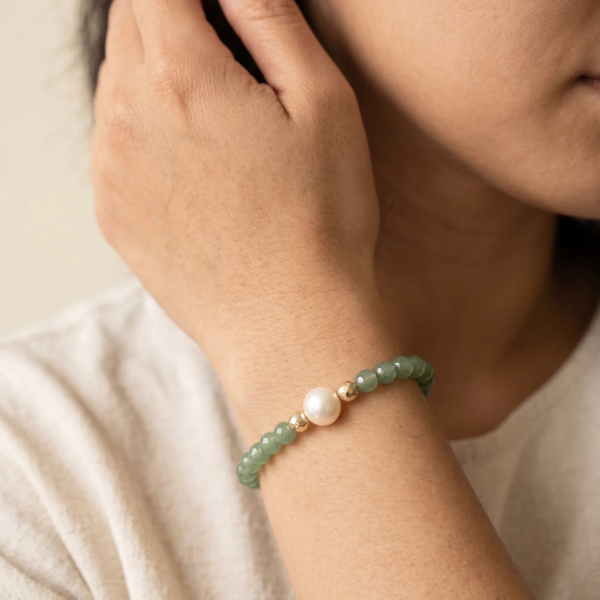 Green aventurine, pearl and initial gold bracelet featuring polished green gemstone beads, lustrous freshwater pearls and a personalised gold-filled stamped initial disc.