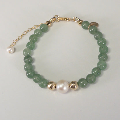 Green aventurine, pearl and initial gold bracelet featuring polished green gemstone beads, lustrous freshwater pearls and a personalised gold-filled stamped initial disc.