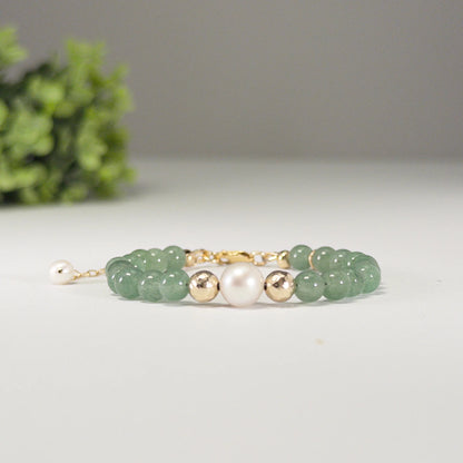 Green aventurine, pearl and initial gold bracelet featuring polished green gemstone beads, lustrous freshwater pearls and a personalised gold-filled stamped initial disc.