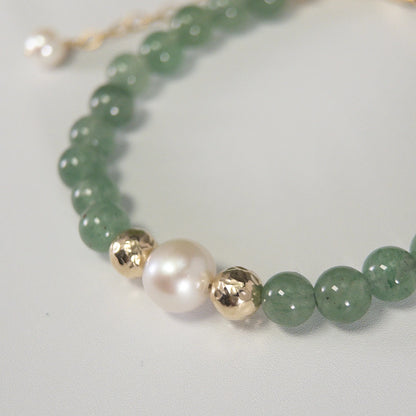 Green aventurine, pearl and initial gold bracelet featuring polished green gemstone beads, lustrous freshwater pearls and a personalised gold-filled stamped initial disc.