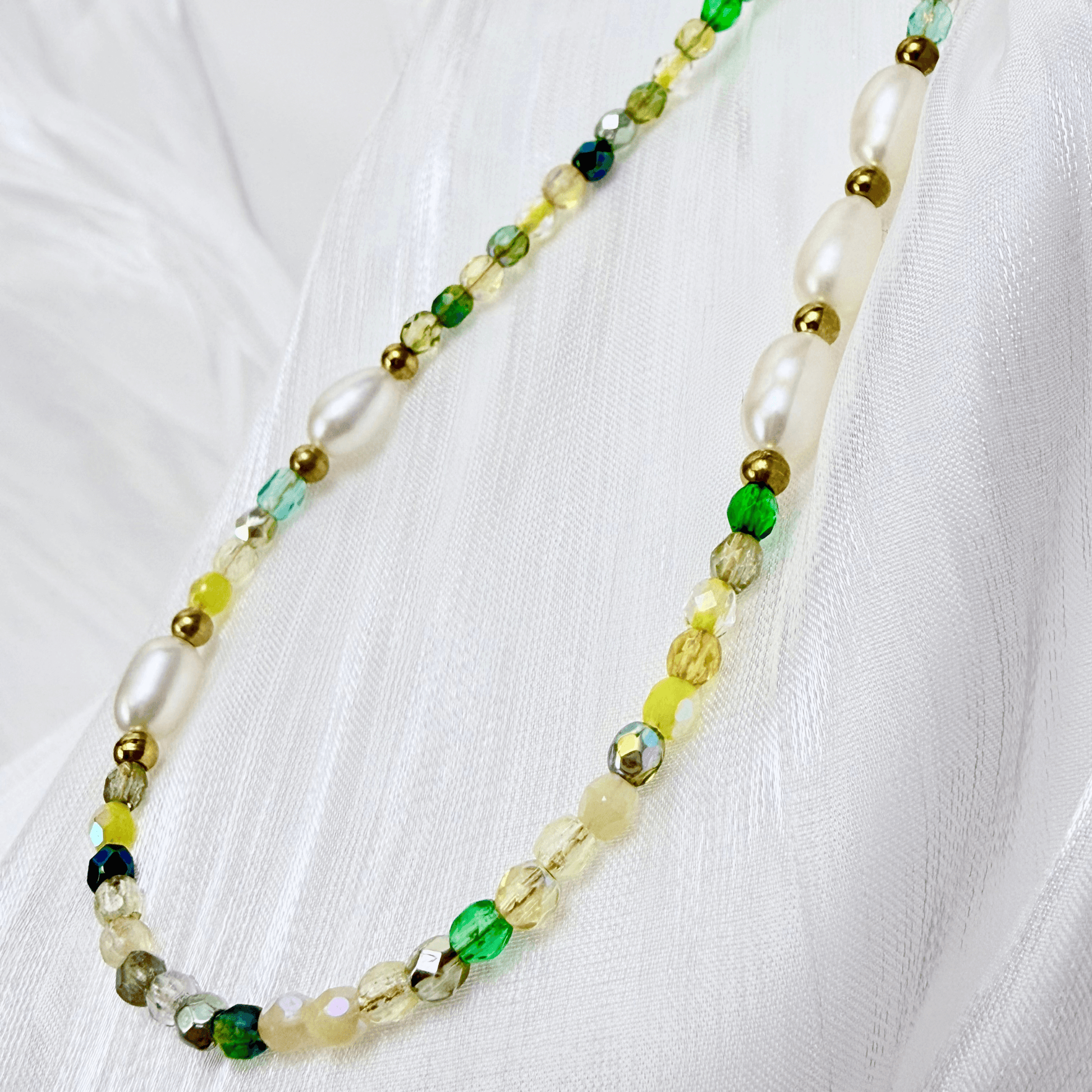 Handmade necklace with 3mm green Czech glass beads and freshwater pearls, finished with gold or silver findings.