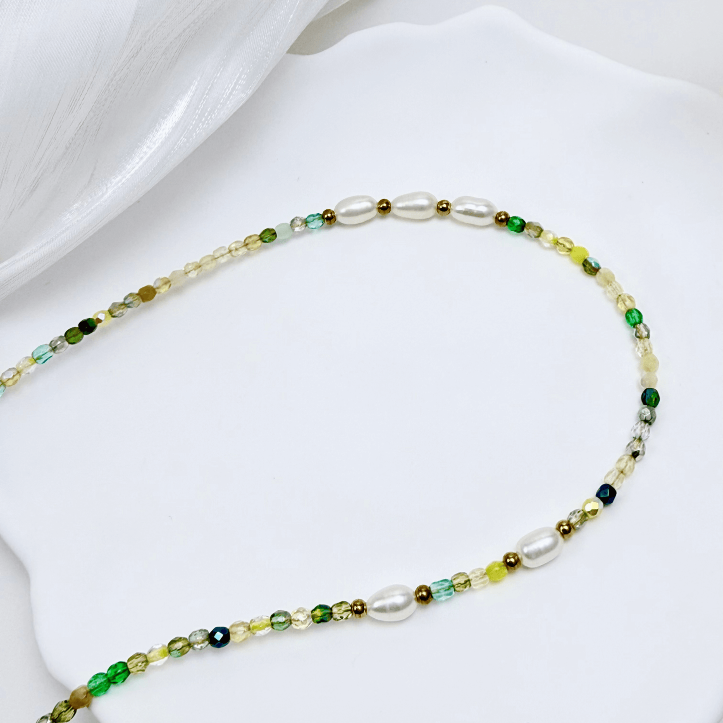 Handmade necklace with 3mm green Czech glass beads and freshwater pearls, finished with gold or silver findings.