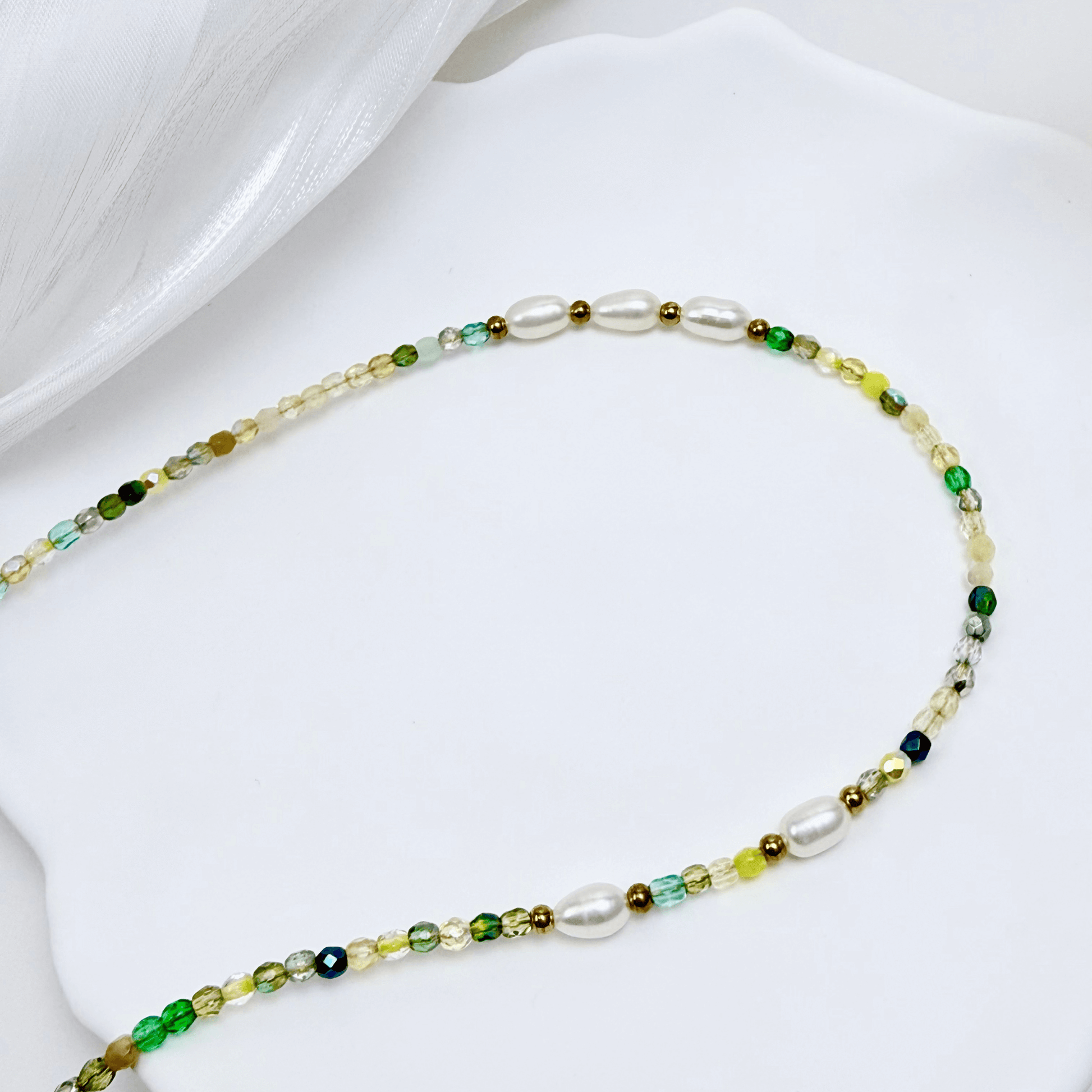 Handmade necklace with 3mm green Czech glass beads and freshwater pearls, finished with gold or silver findings.