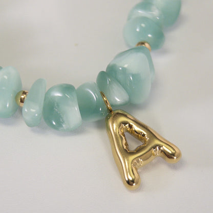 MXW Jewellery Green moonstone beaded necklace with a 14K gold filled bubble initial pendant.