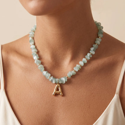MXW Jewellery Green moonstone beaded necklace with a 14K gold filled bubble initial pendant.