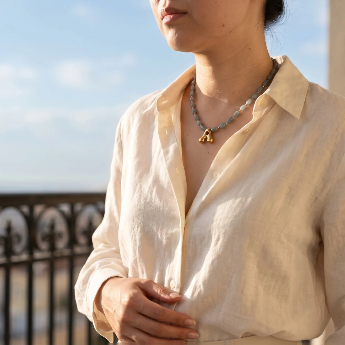Guatemalan jade initial necklace with smooth barrel beads, 14K gold filled spacers and a bubble letter pendant
