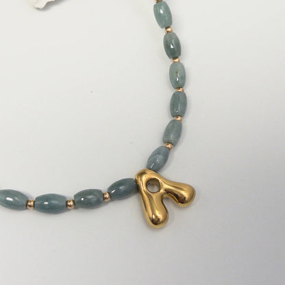 Guatemalan jade initial necklace with smooth barrel beads, 14K gold filled spacers and a bubble letter pendant