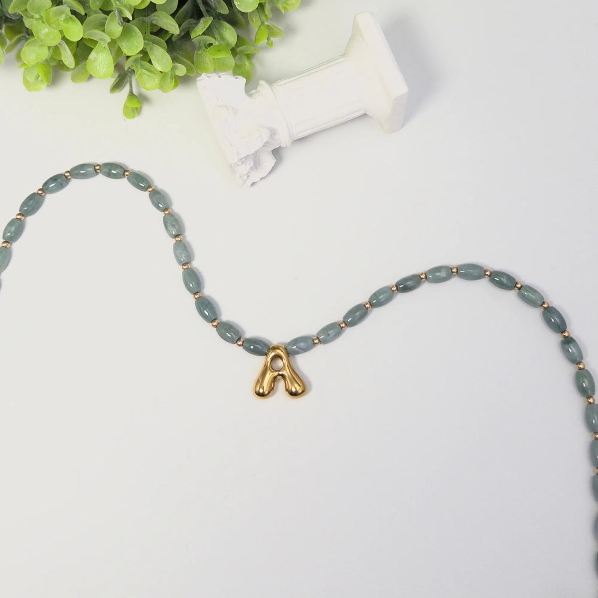 Guatemalan jade initial necklace with smooth barrel beads, 14K gold filled spacers and a bubble letter pendant