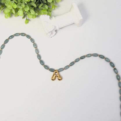 Guatemalan jade initial necklace with smooth barrel beads, 14K gold filled spacers and a bubble letter pendant
