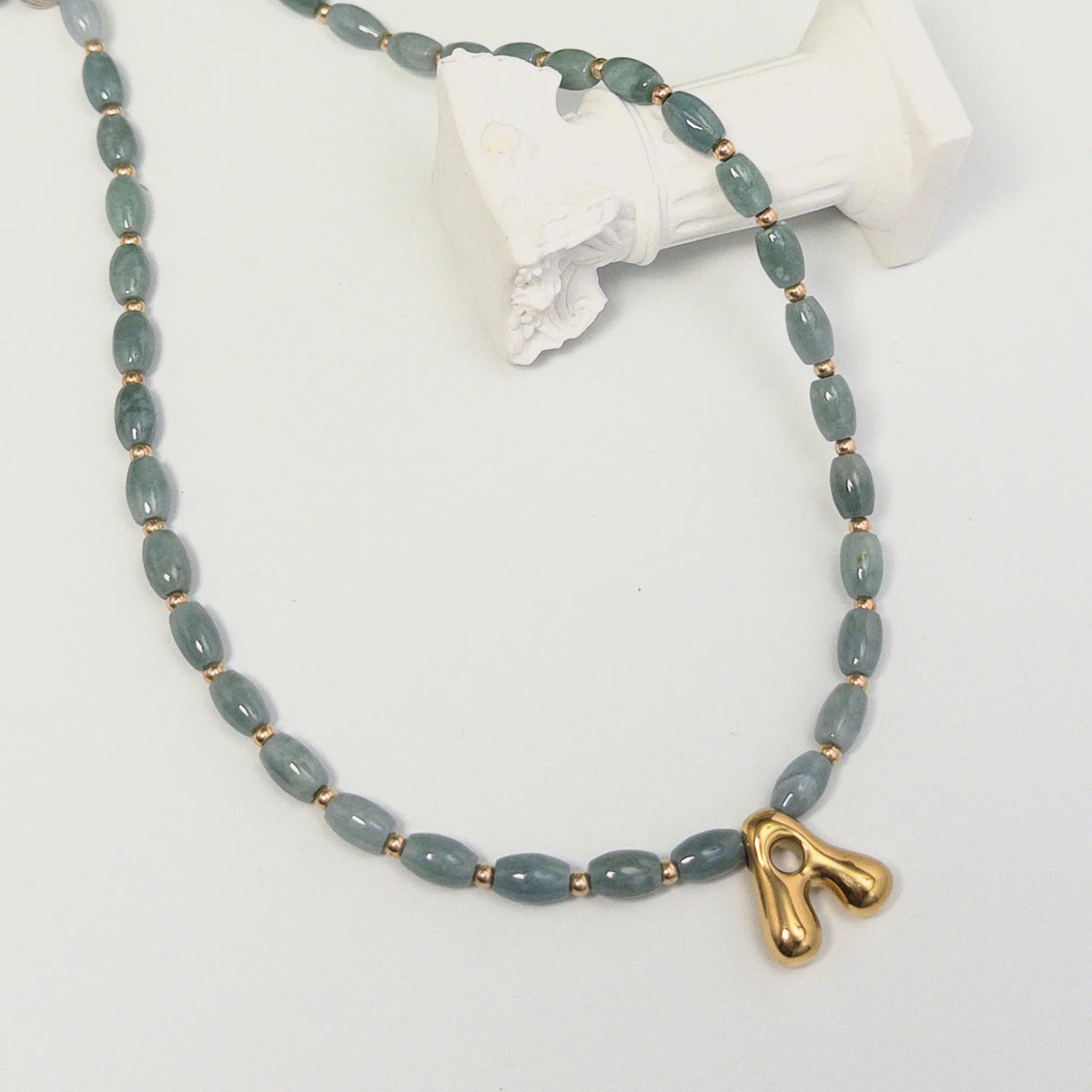 Guatemalan jade initial necklace with smooth barrel beads, 14K gold filled spacers and a bubble letter pendant