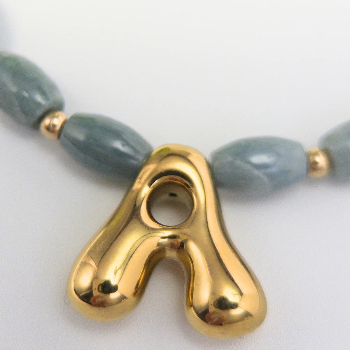 Guatemalan jade initial necklace with smooth barrel beads, 14K gold filled spacers and a bubble letter pendant