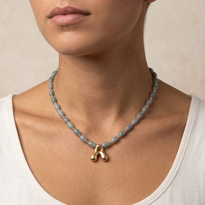 Guatemalan jade initial necklace with smooth barrel beads, 14K gold filled spacers and a bubble letter pendant