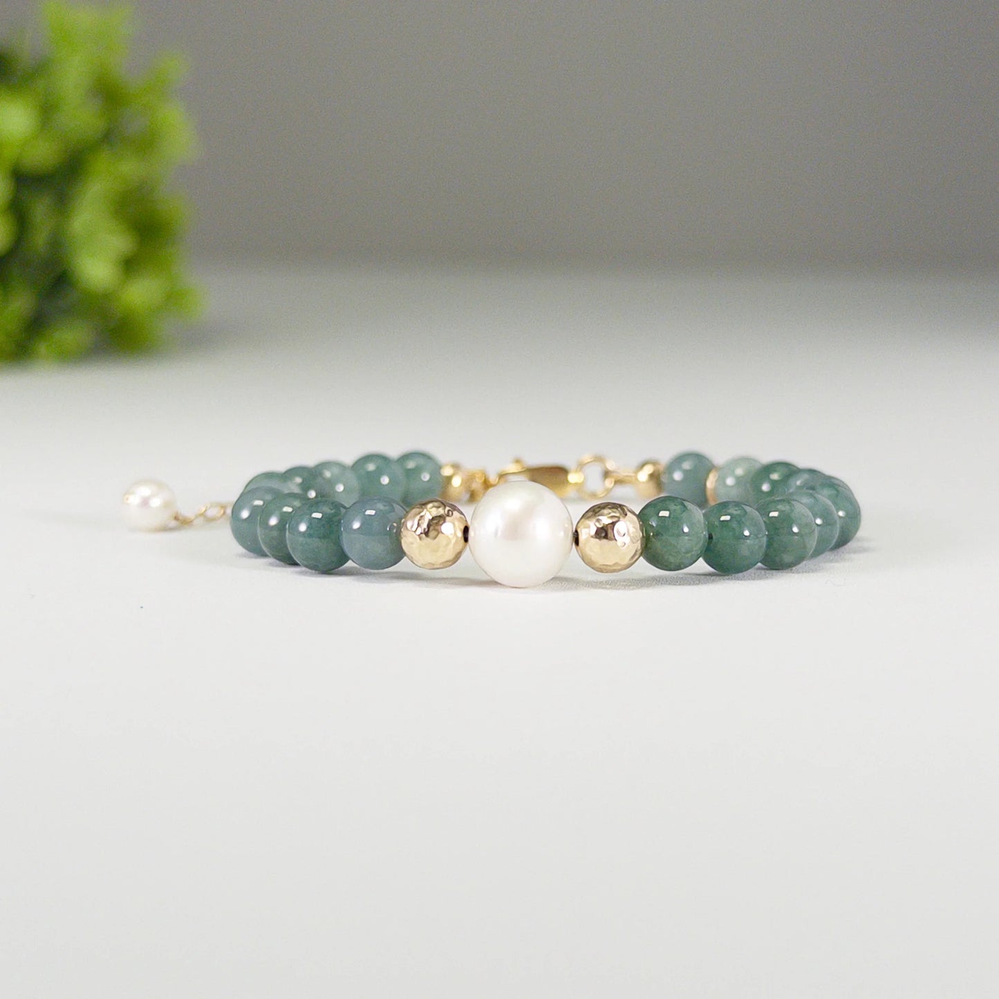 Guatemalan jade, pearl and initial gold bracelet featuring premium blue green Guatemalan jade beads, lustrous pearls and a personalised gold-filled stamped initial disc.