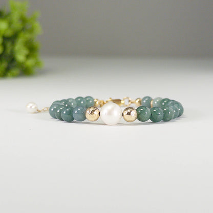 Guatemalan jade, pearl and initial gold bracelet featuring premium blue green Guatemalan jade beads, lustrous pearls and a personalised gold-filled stamped initial disc.