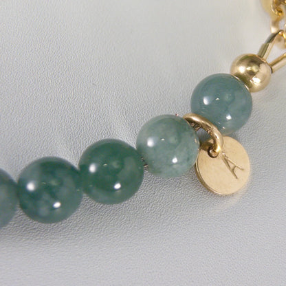 Guatemalan jade, pearl and initial gold bracelet featuring premium blue green Guatemalan jade beads, lustrous pearls and a personalised gold-filled stamped initial disc.