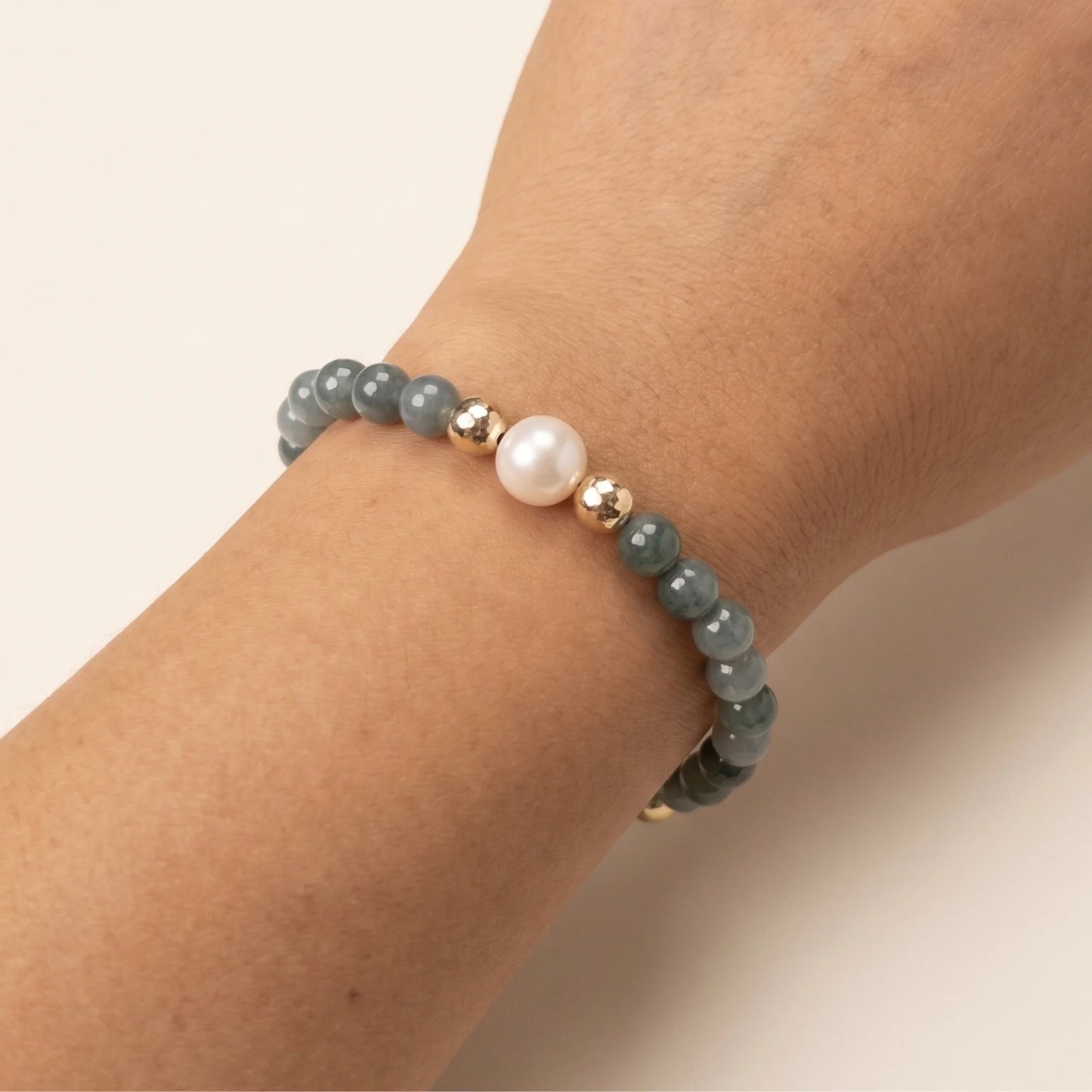Guatemalan jade, pearl and initial gold bracelet featuring premium blue green Guatemalan jade beads, lustrous pearls and a personalised gold-filled stamped initial disc.