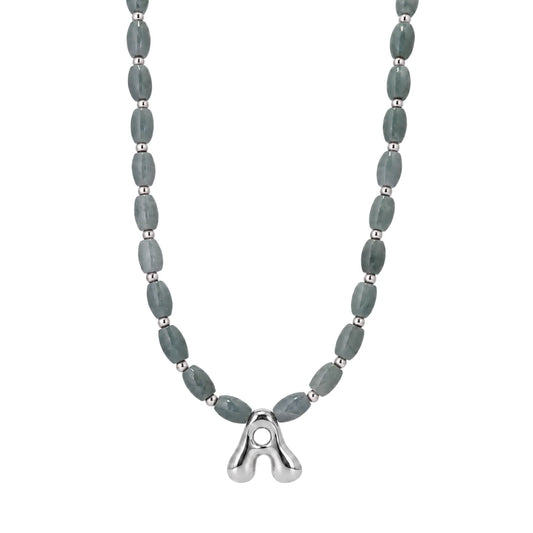 Guatemalan jade initial necklace with smooth barrel beads, sterling silver spacers and a bubble letter pendant
