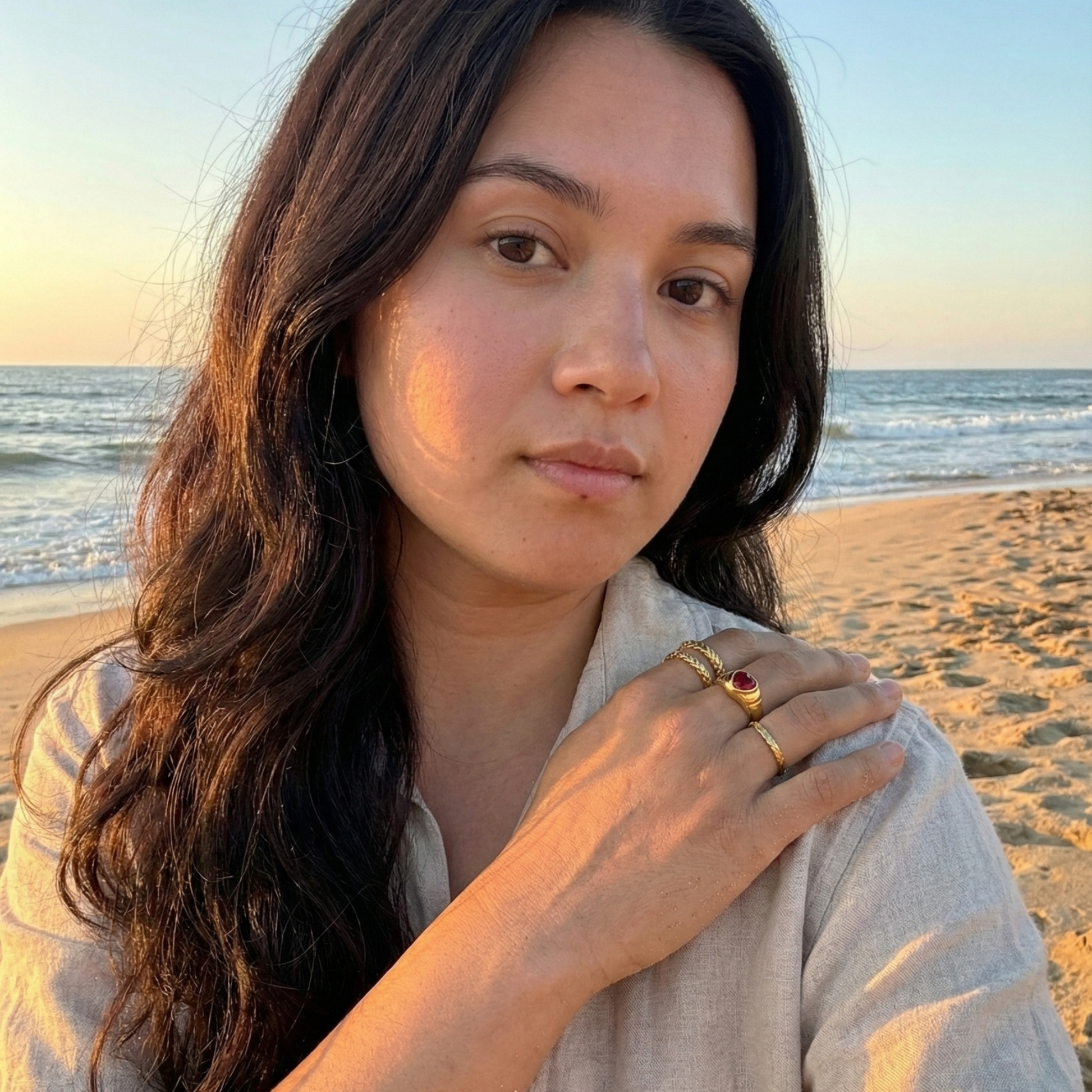 Minimal hammered slim gold ring with organic texture on a clean background.