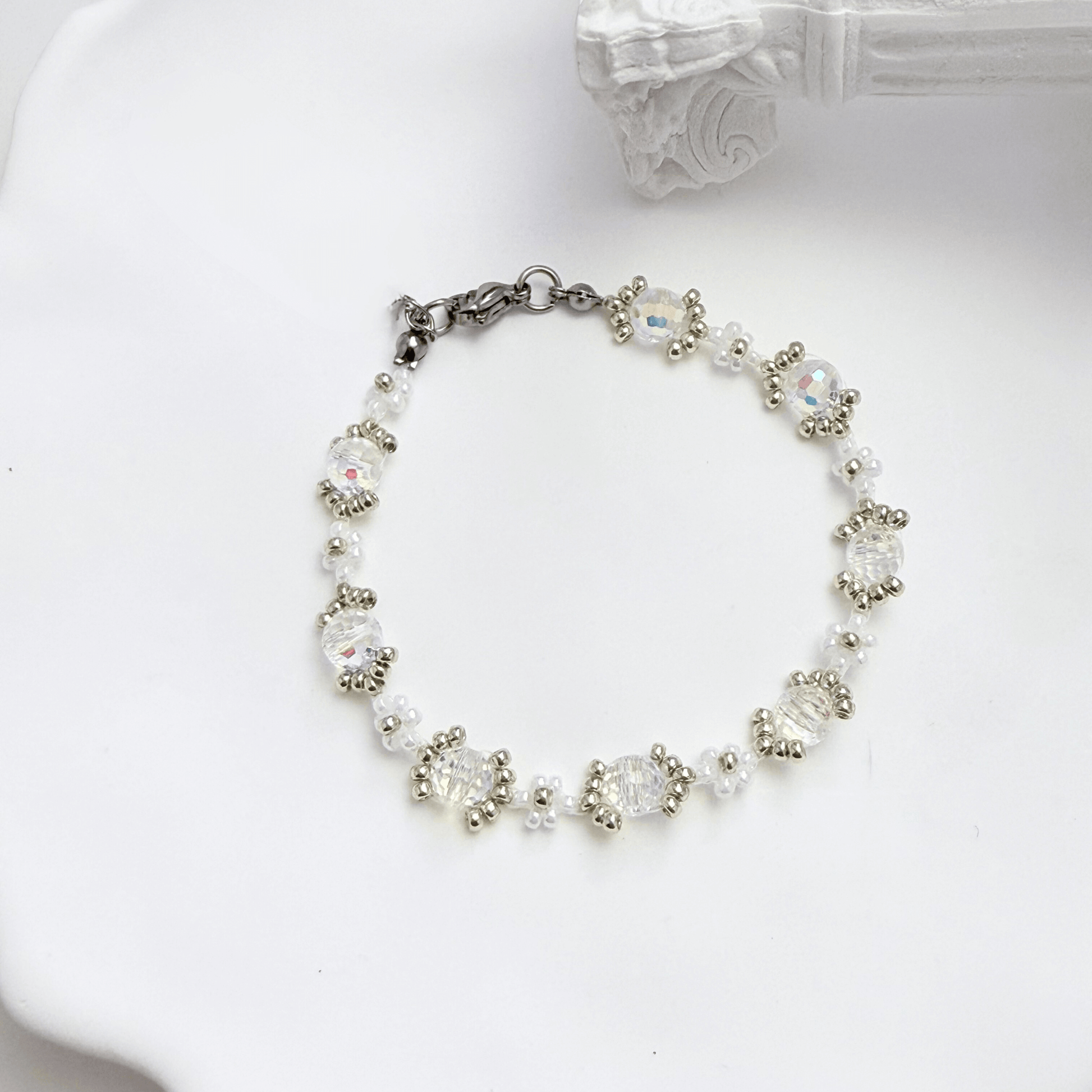 Handmade clear crystal beaded flower bracelet with iridescent Japanese glass beads in gold or silver finish