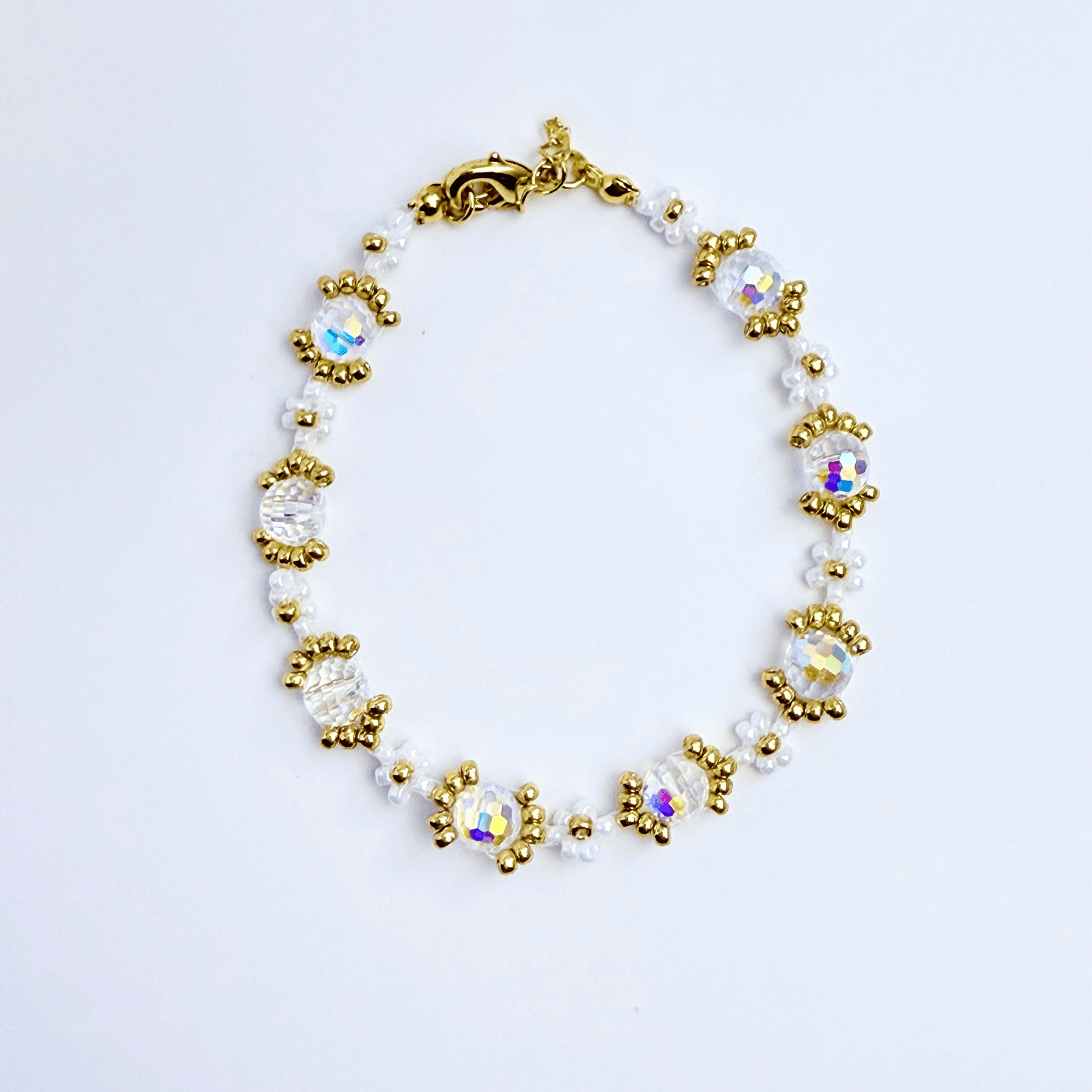 Handmade clear crystal beaded flower bracelet with iridescent Japanese glass beads in gold or silver finish