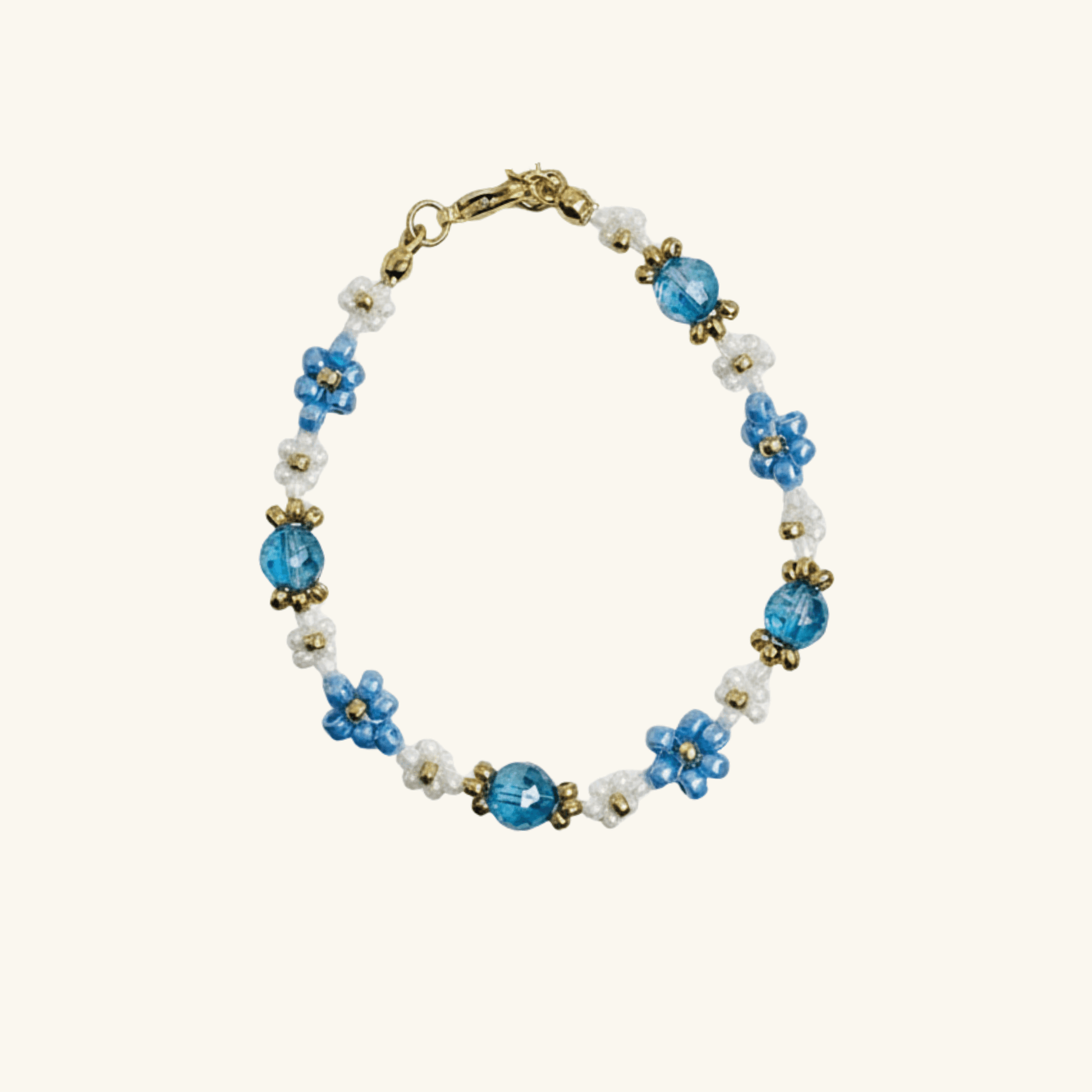 Handmade blue daisy flower beaded bracelet with Japanese glass beads and gold accents, available in gold or silver finish
