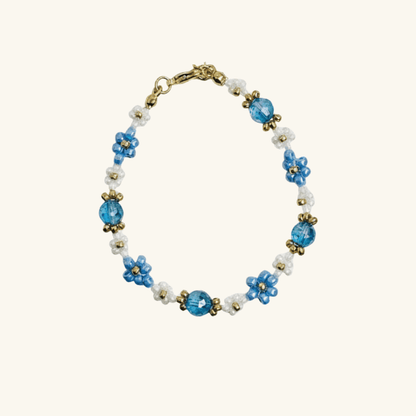 Handmade blue daisy flower beaded bracelet with Japanese glass beads and gold accents, available in gold or silver finish