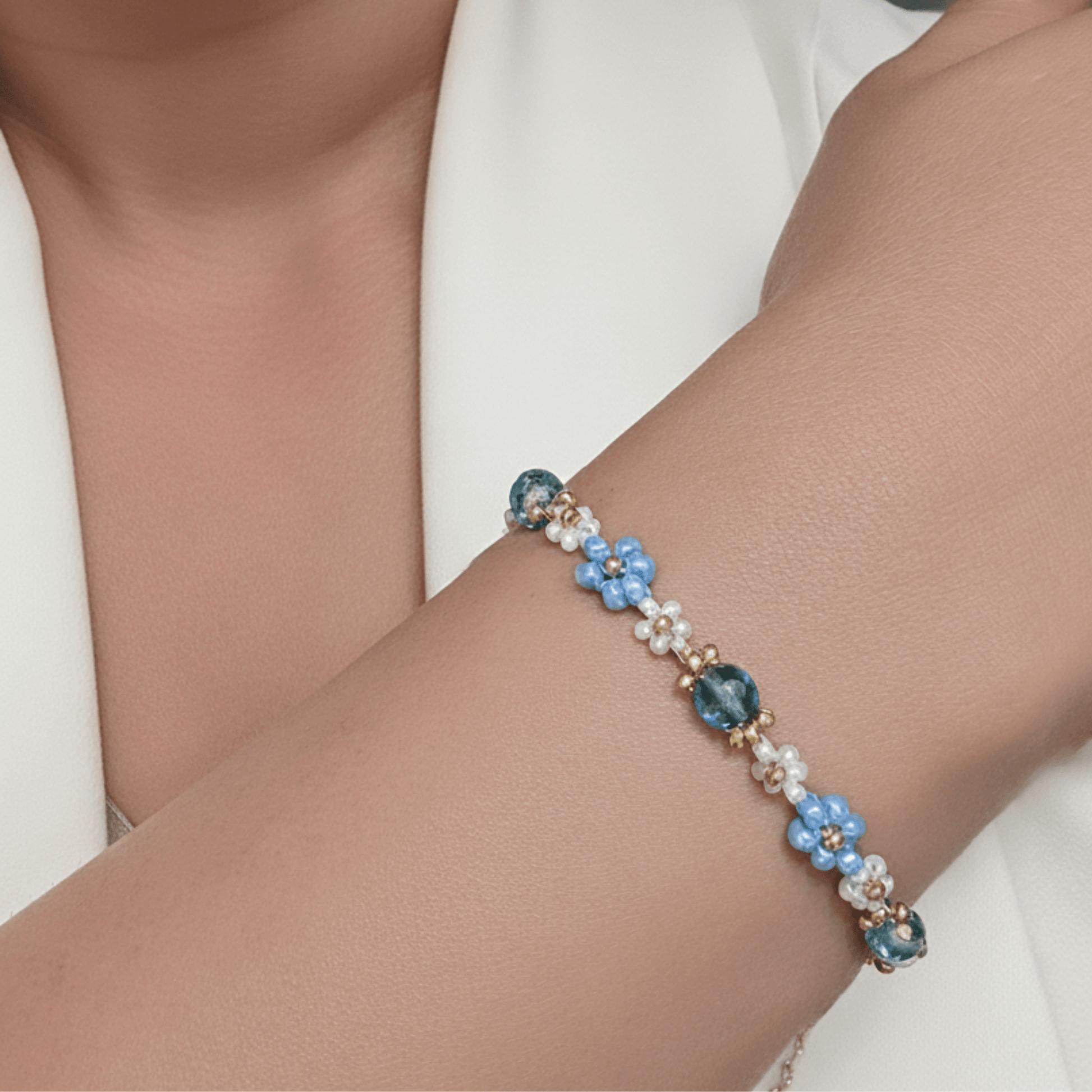 Handmade blue daisy flower beaded bracelet with Japanese glass beads and gold accents, available in gold or silver finish