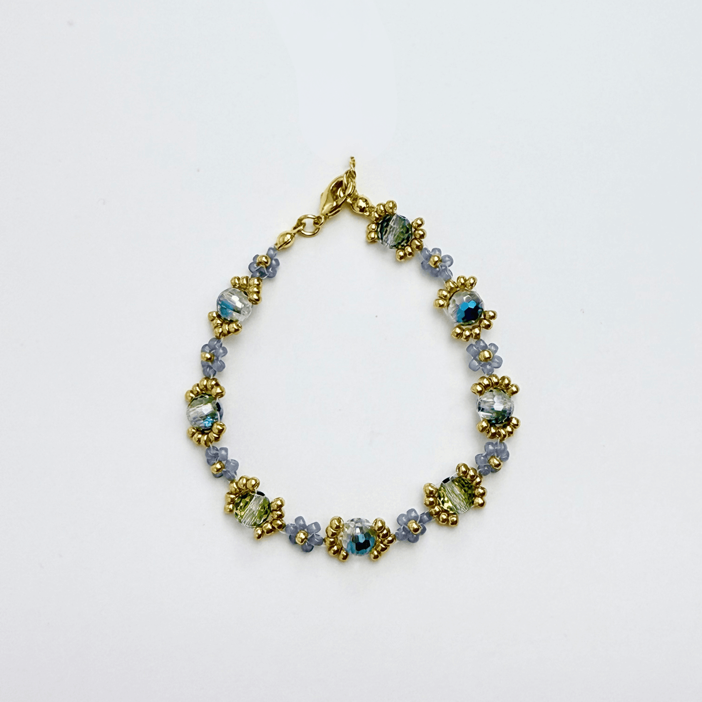 Handmade blue-grey beaded flower bracelet with Japanese glass beads and gold or silver accents