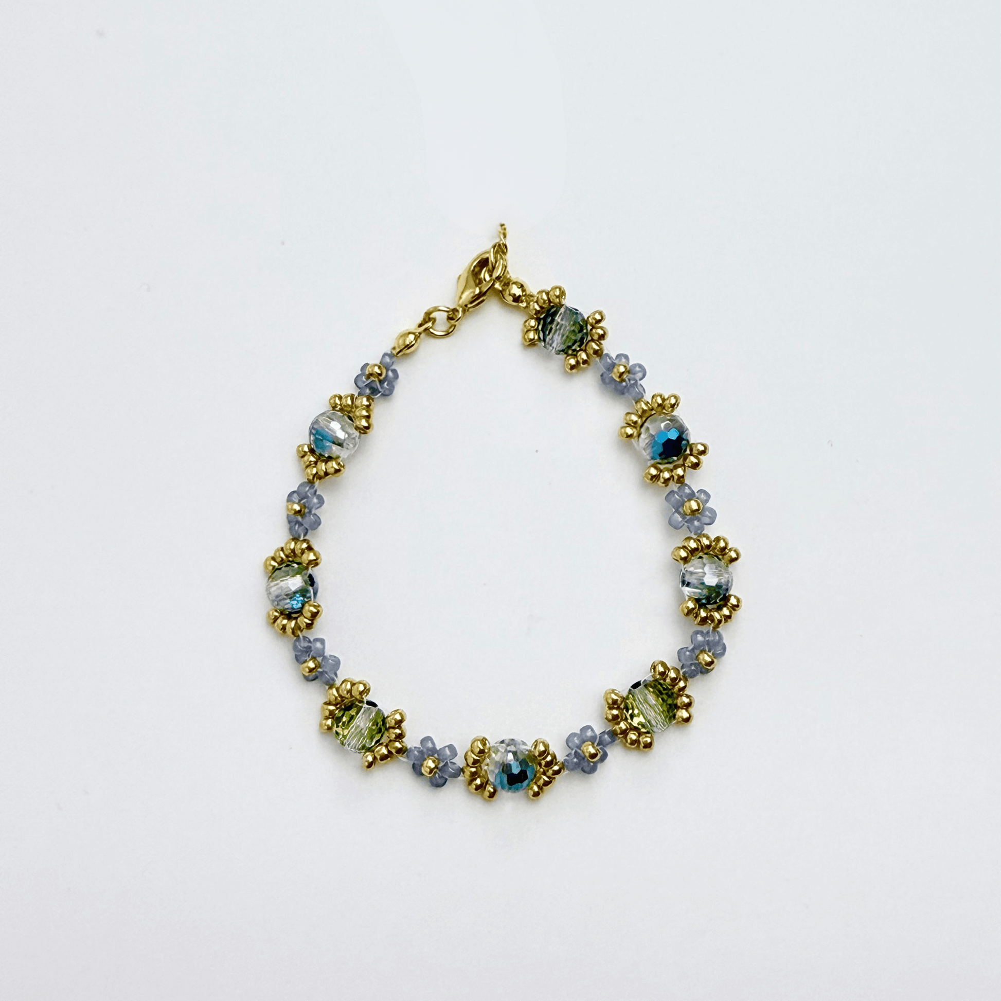 Handmade blue-grey beaded flower bracelet with Japanese glass beads and gold or silver accents