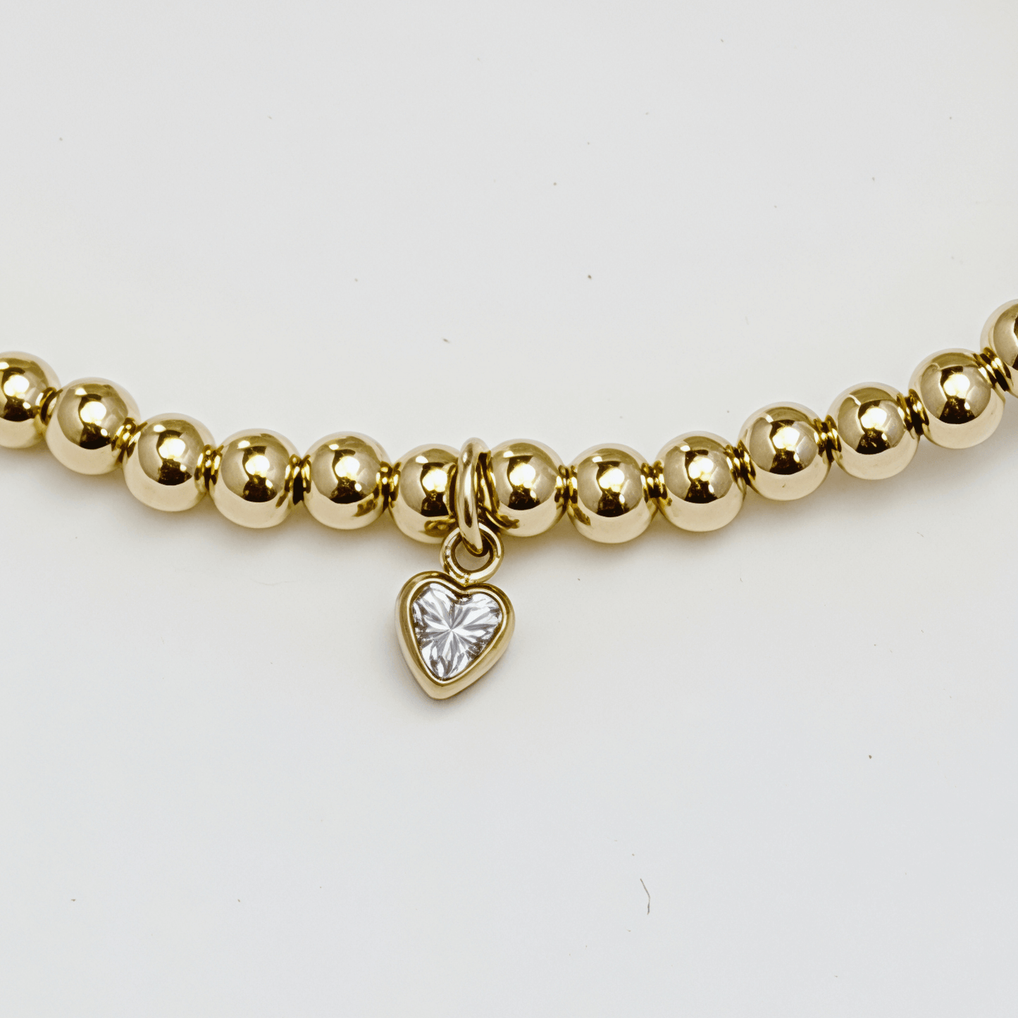 Waterproof heart charm gold bead bracelet with crystal detail – MXW Jewellery