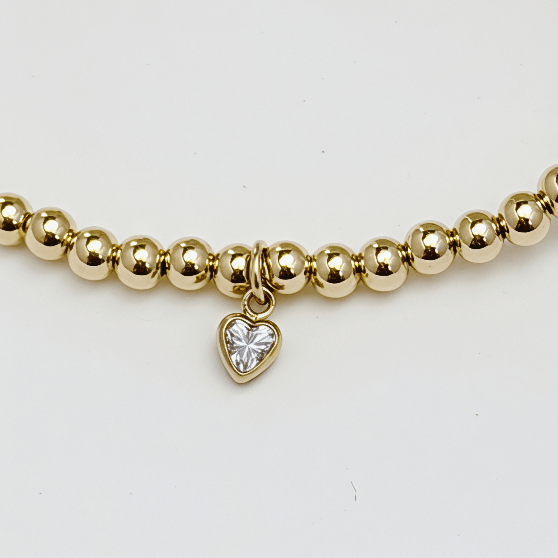 Waterproof heart charm gold bead bracelet with crystal detail – MXW Jewellery