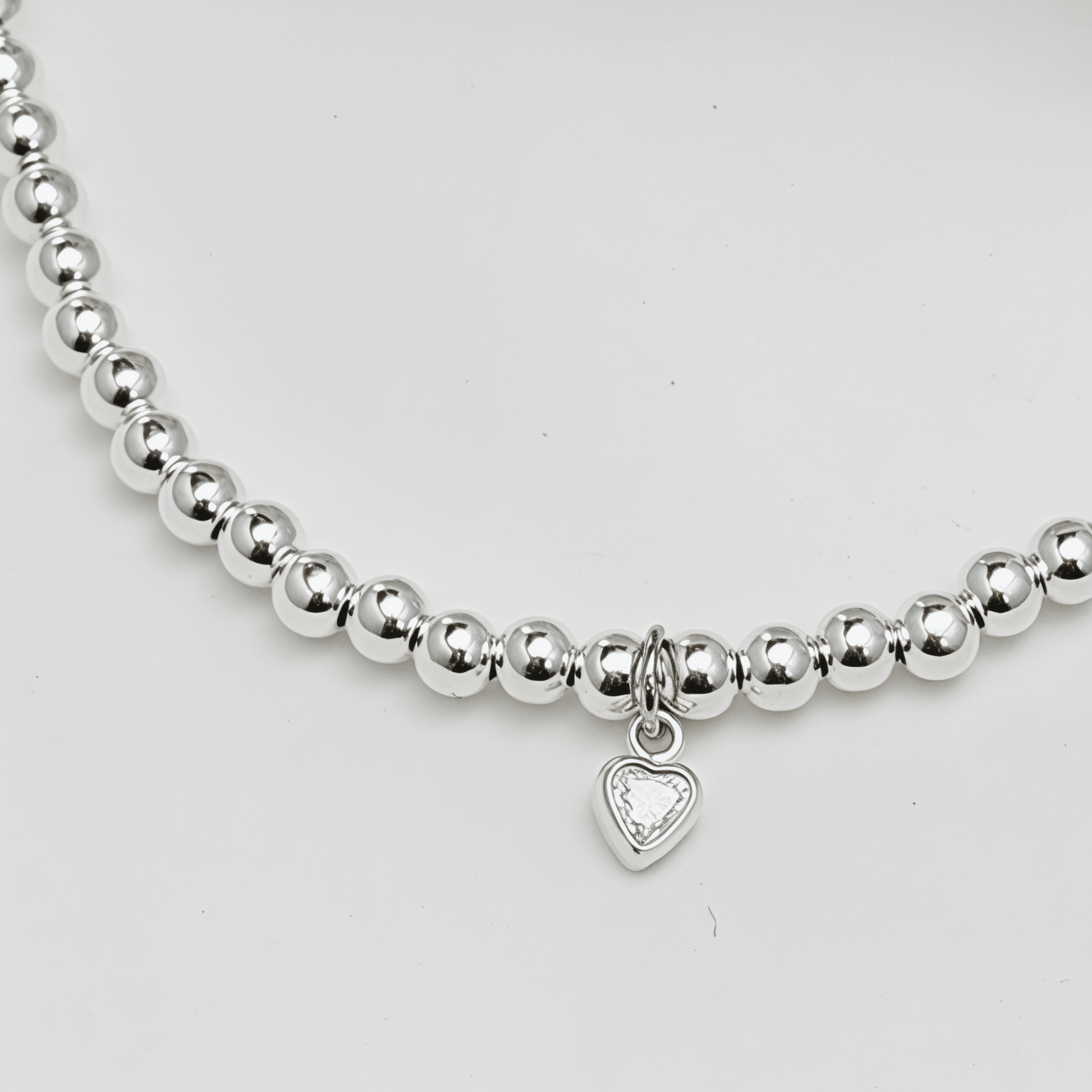 Heart charm sterling silver bead bracelet with crystal detail and polished silver beads – MXW Jewellery