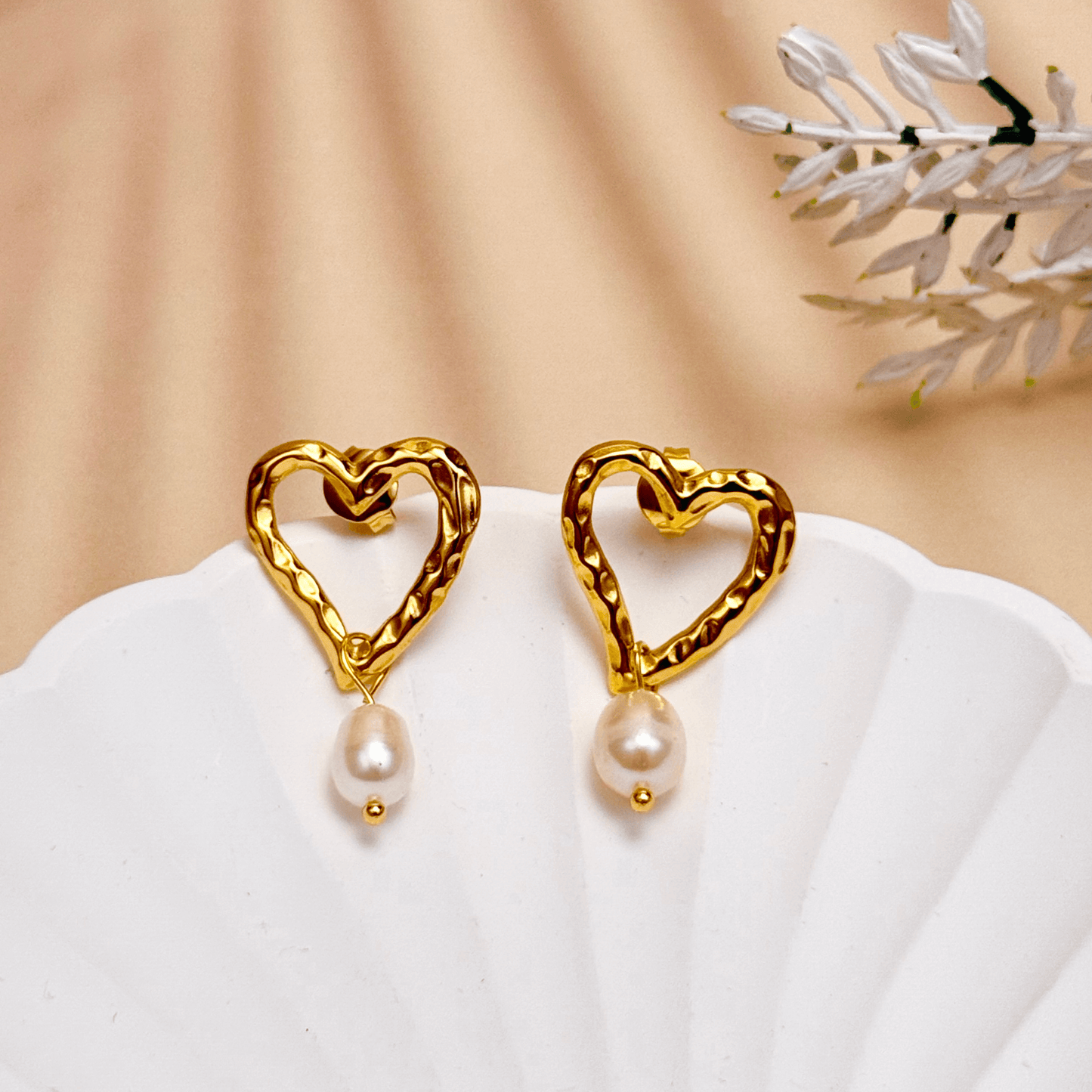 Gold hammered open-heart earrings with natural freshwater pearl drops, made from PVD gold plated stainless steel