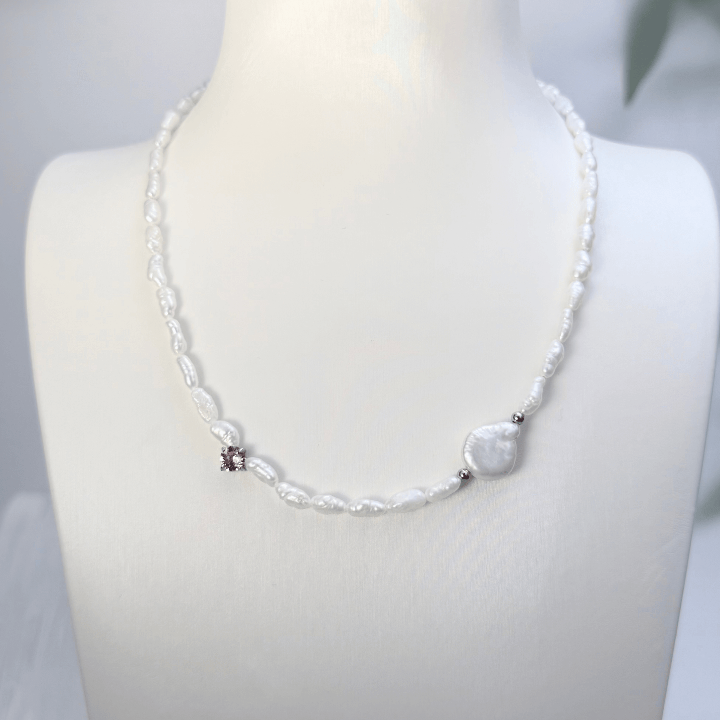 Handmade necklace with Keshi and baroque pearls, accented by a Swarovski crystal element in a birthstone-inspired color, with gold or silver findings.