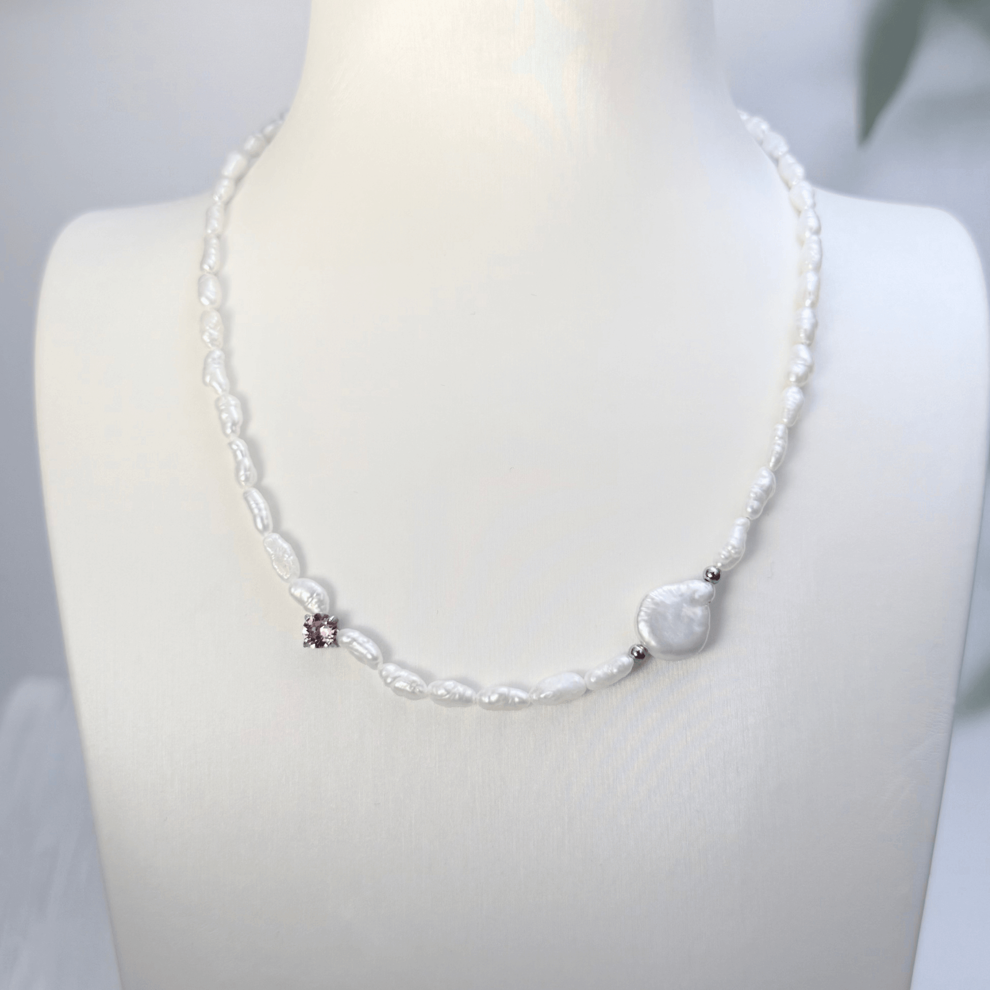 Handmade necklace with Keshi and baroque pearls, accented by a Swarovski crystal element in a birthstone-inspired color, with gold or silver findings.