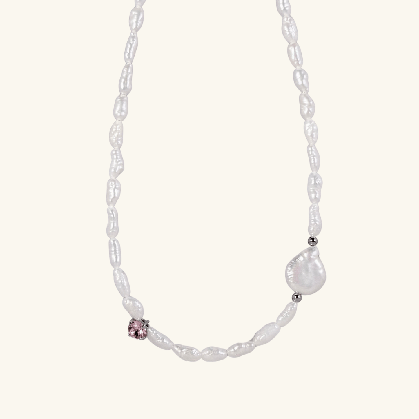 Handmade necklace with Keshi and baroque pearls, accented by a Swarovski crystal element in a birthstone-inspired color, with gold or silver findings.