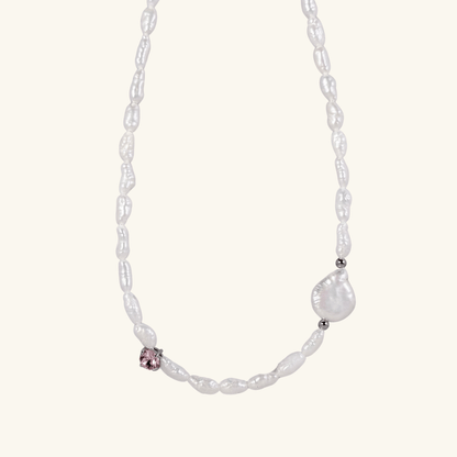 Handmade necklace with Keshi and baroque pearls, accented by a Swarovski crystal element in a birthstone-inspired color, with gold or silver findings.
