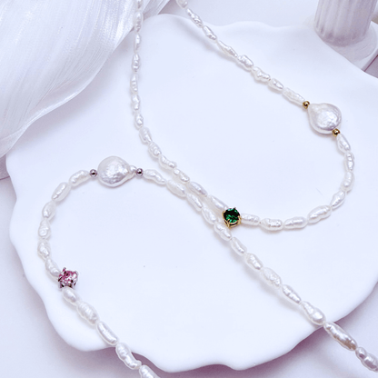 Handmade necklace with Keshi and baroque pearls, accented by a Swarovski crystal element in a birthstone-inspired color, with gold or silver findings.