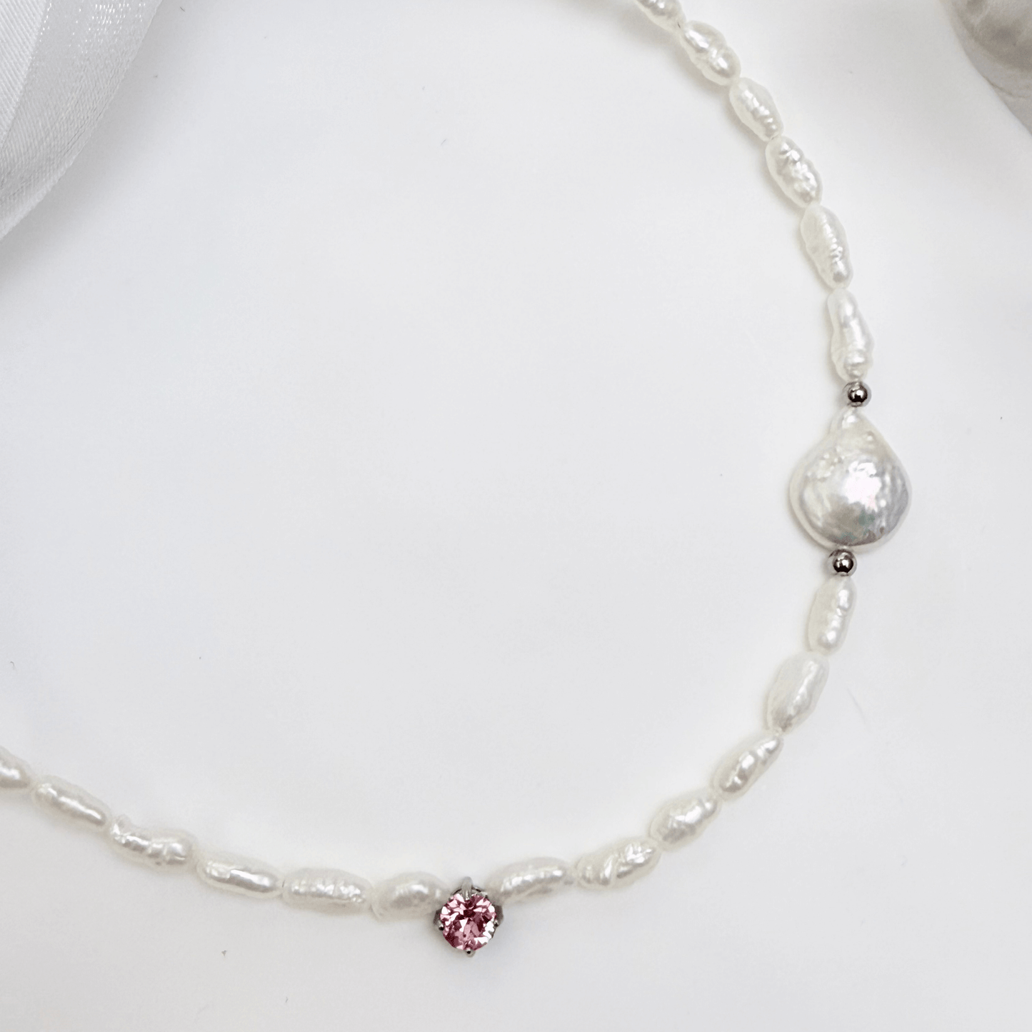Handmade necklace with Keshi and baroque pearls, accented by a Swarovski crystal element in a birthstone-inspired color, with gold or silver findings.