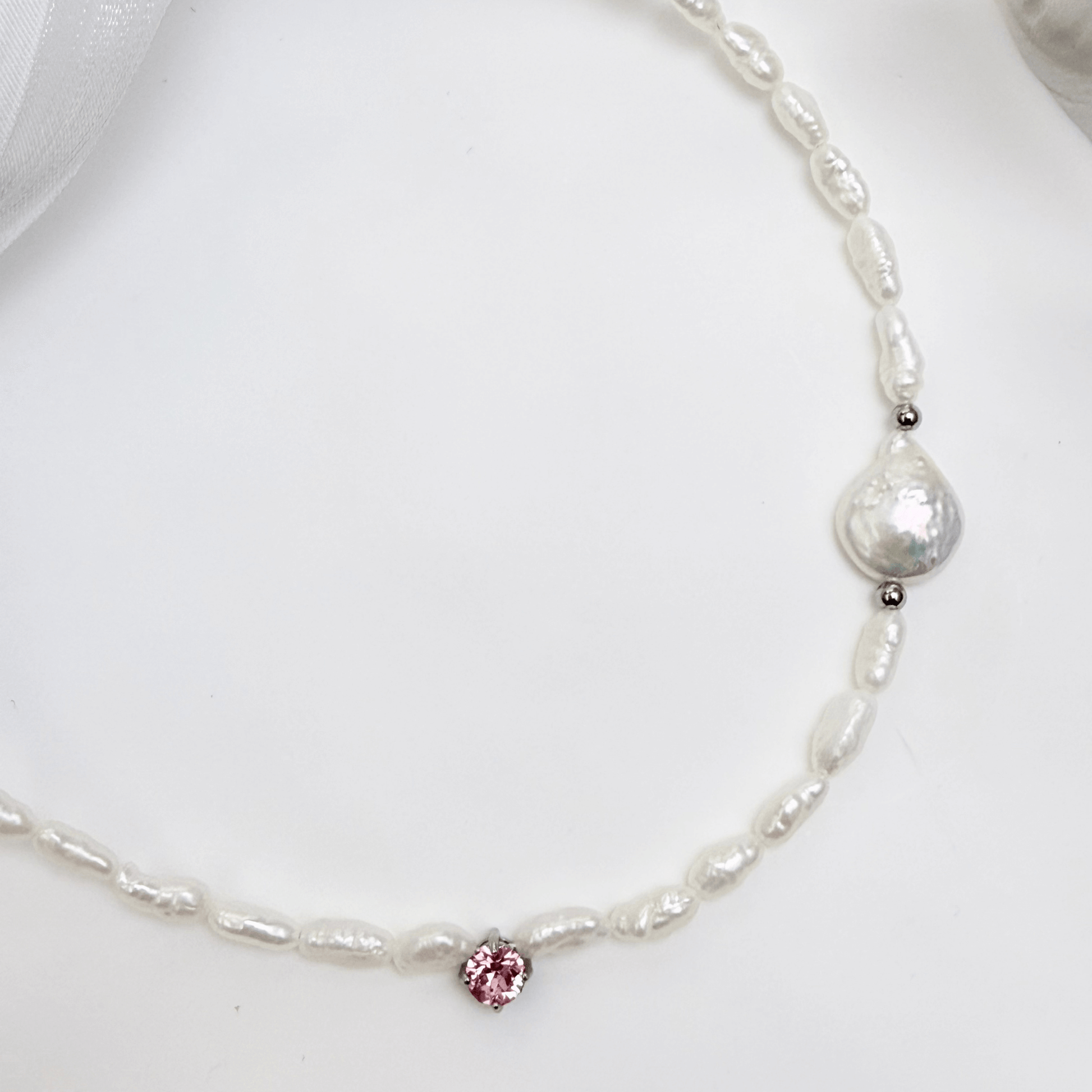 Handmade necklace with Keshi and baroque pearls, accented by a Swarovski crystal element in a birthstone-inspired color, with gold or silver findings.