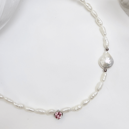 Handmade necklace with Keshi and baroque pearls, accented by a Swarovski crystal element in a birthstone-inspired color, with gold or silver findings.