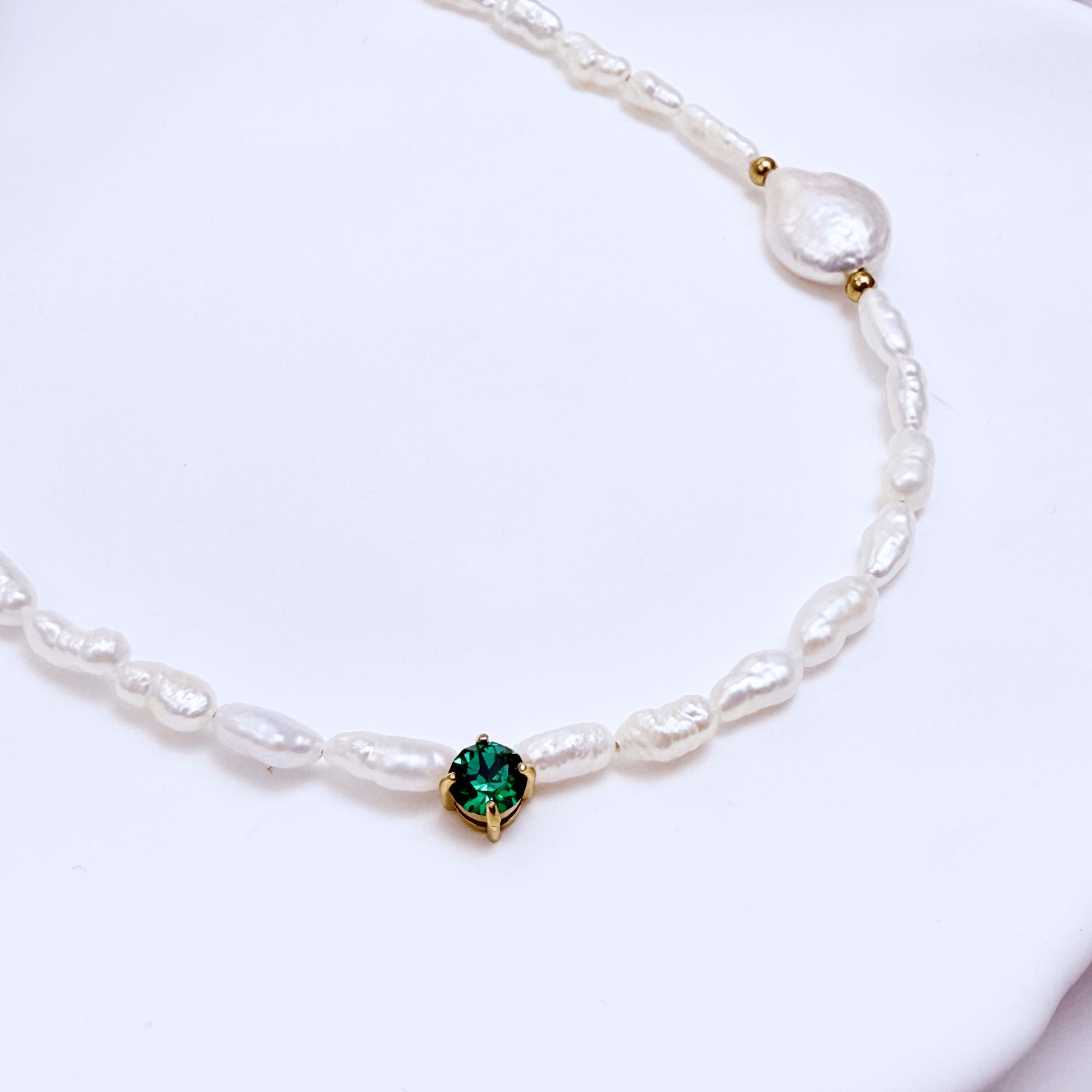Handmade necklace with Keshi and baroque pearls, accented by a Swarovski crystal element in a birthstone-inspired color, with gold or silver findings.