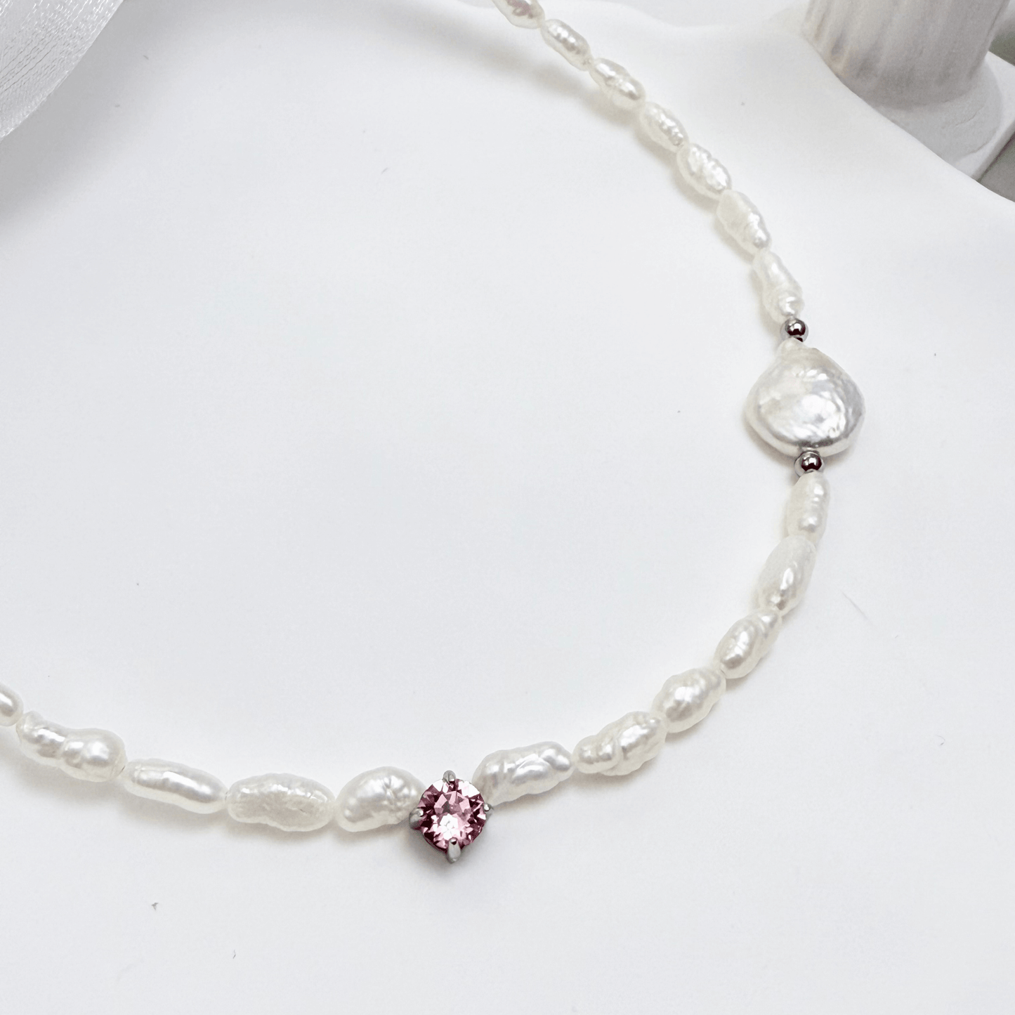 Handmade necklace with Keshi and baroque pearls, accented by a Swarovski crystal element in a birthstone-inspired color, with gold or silver findings.