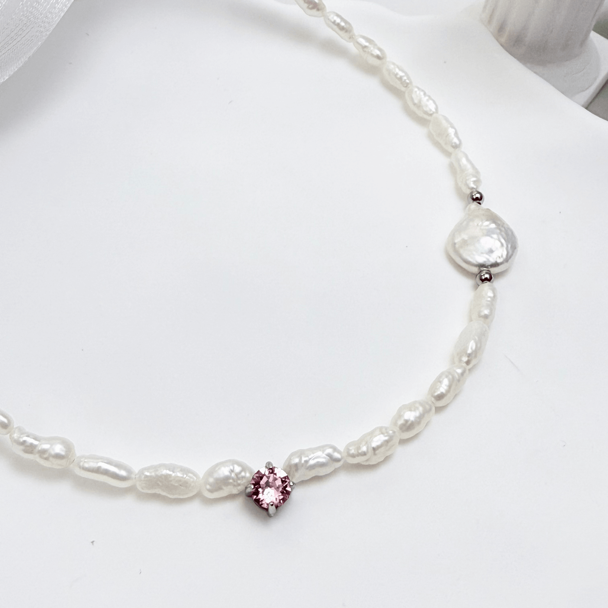 Handmade necklace with Keshi and baroque pearls, accented by a Swarovski crystal element in a birthstone-inspired color, with gold or silver findings.