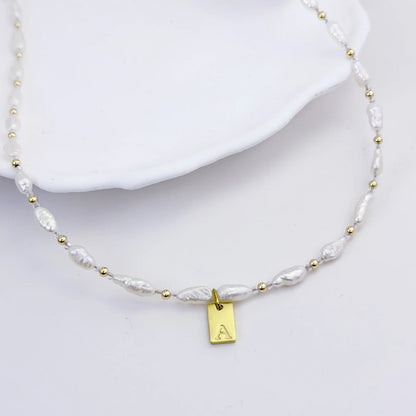 Keshi freshwater pearl and 14K gold filled beaded necklace with Swarovski crystal accents and personalised gold initial tag, hand-finished in Australia