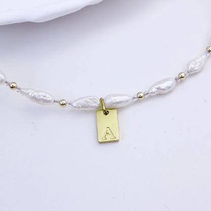 Keshi freshwater pearl and 14K gold filled beaded necklace with Swarovski crystal accents and personalised gold initial tag, hand-finished in Australia