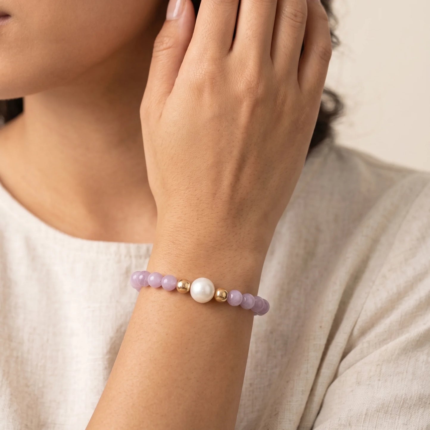 Kunzite, pearl and initial gold bracelet featuring translucent violet kunzite beads, lustrous freshwater pearls and a personalised gold-filled stamped initial disc.
